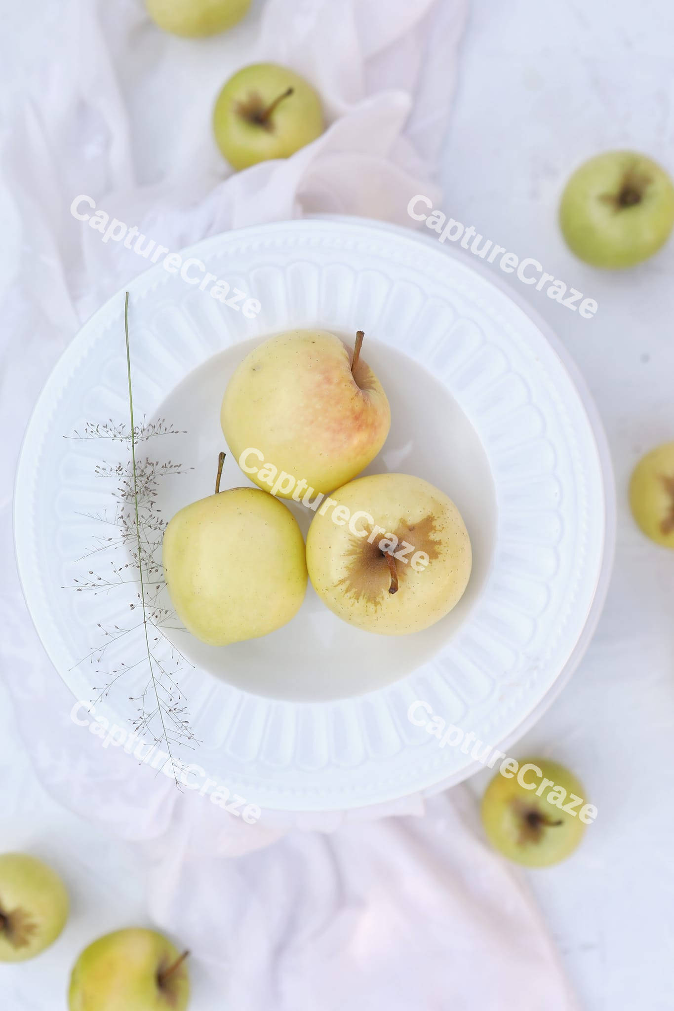 Golden apples inside a plate